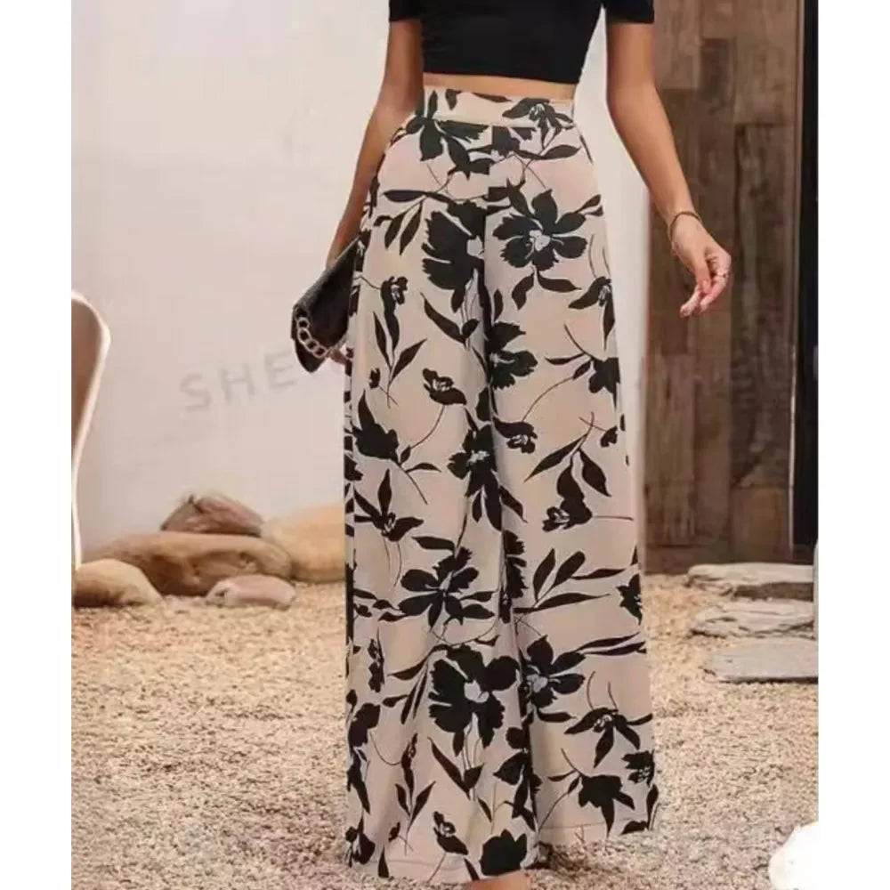 Women's wide-leg flowy pants with a vibrant print. Perfect for casual summer wear, comfortable & stylish.