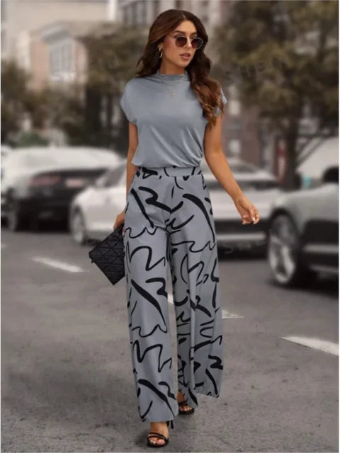 Flowy wide-leg printed pants for women. Lightweight and breathable, perfect for a casual, trendy summer look.