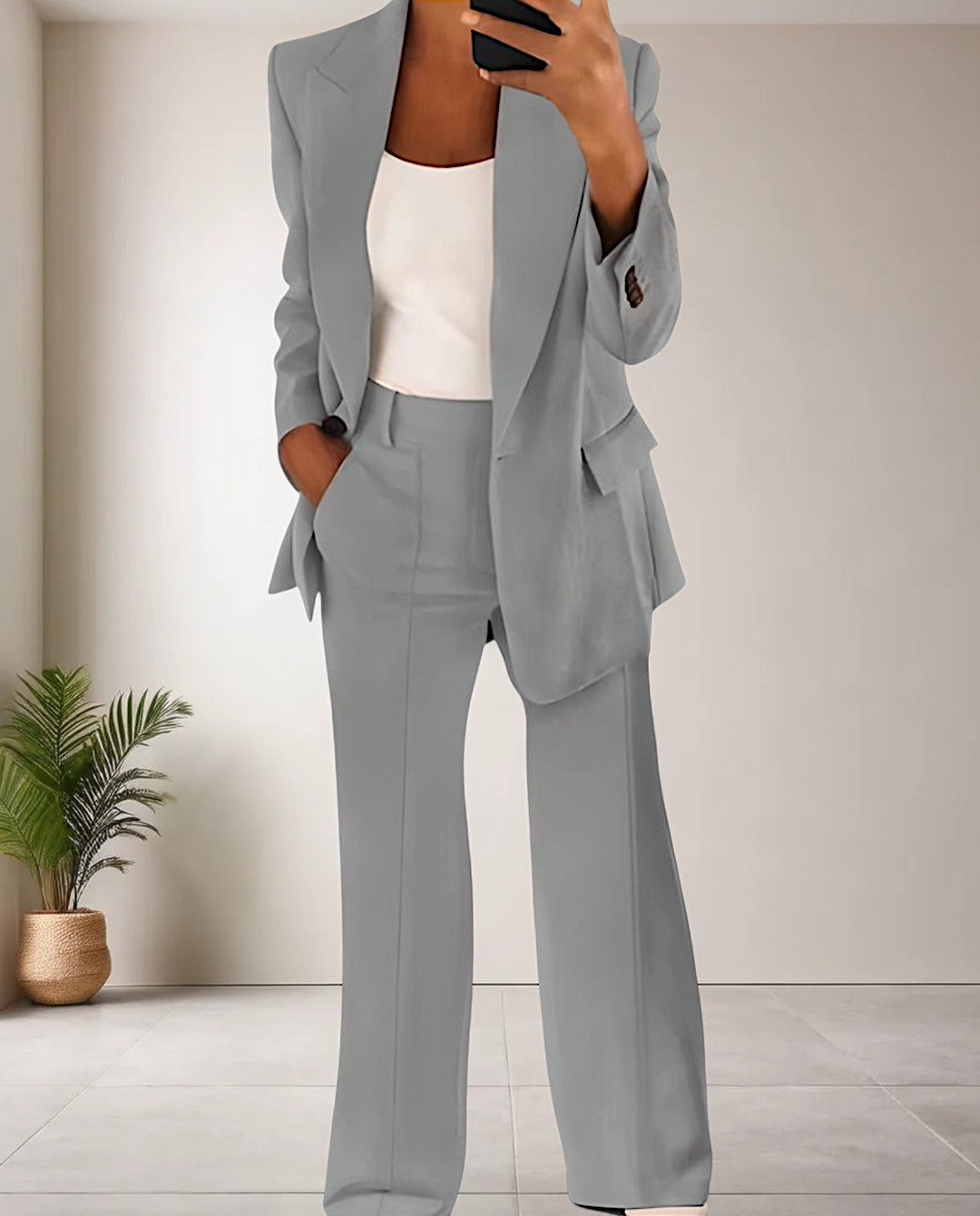 Stylish women's pantsuit set in a formal office setting. A trendy and chic two-piece for professional fashion.