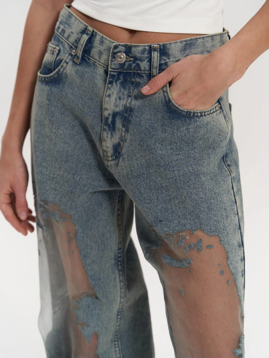 Stylish women's blue high waist wide leg jeans with elegant mesh panel detailing, ideal for contemporary fashion.