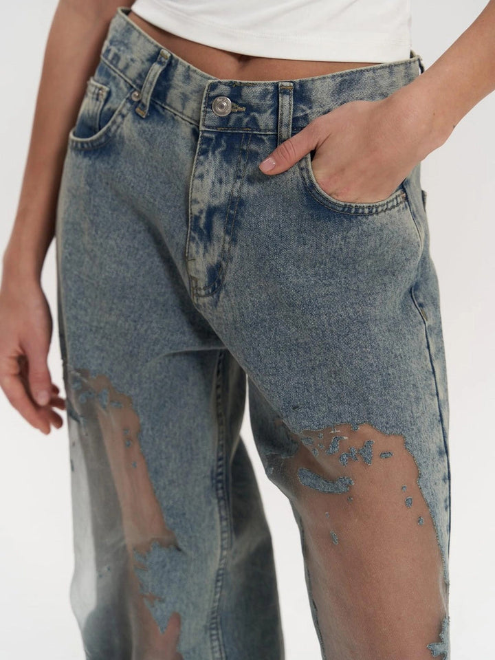 Stylish women's blue high waist wide leg jeans with elegant mesh panel detailing, ideal for contemporary fashion.