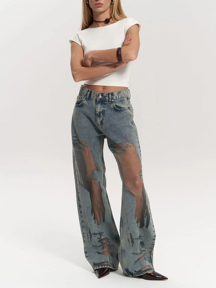 Casual women's blue high waist wide leg jeans with breathable mesh panels, combining comfort with modern fashion trends.