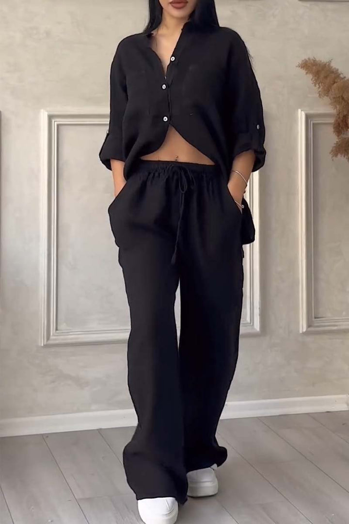 Flowy women's linen two-piece set: a comfortable blouse & wide-leg trousers for casual and travel wear.