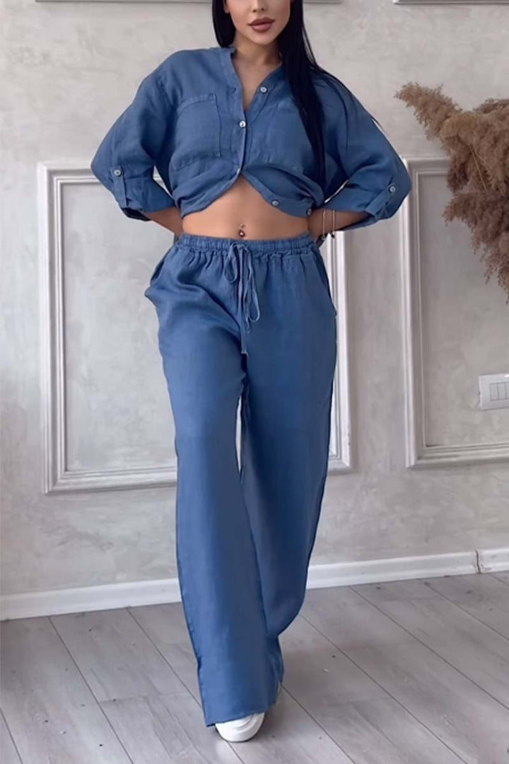 Stylish women's linen two-piece set with a relaxed blouse and comfortable wide-leg trousers.