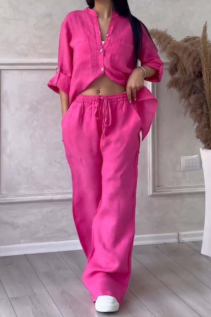 Comfortable women's two-piece linen outfit. Elegant blouse & wide-leg trousers for versatile styling.