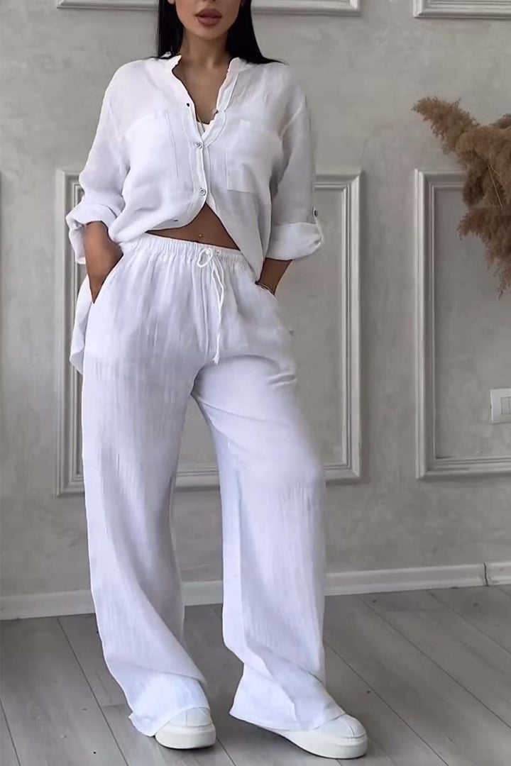 Relaxed fit women's linen set featuring a stylish blouse & airy wide-leg pants, ideal for summer.