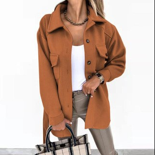 Woman models trendy Elara windbreaker, showcasing its lightweight design and stylish everyday look.
