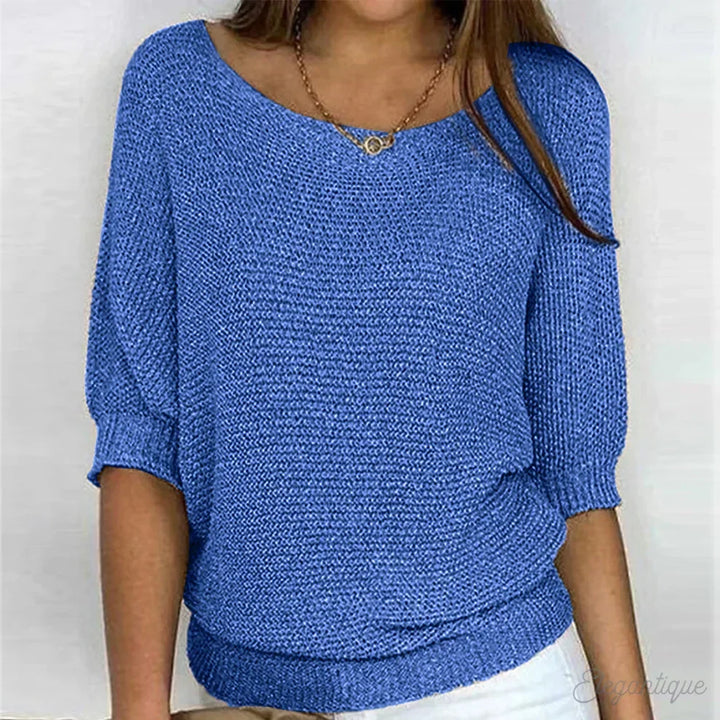 Close-up of a women's cozy textured sweater. Elegant knit, comfortable top for chilly autumn days.