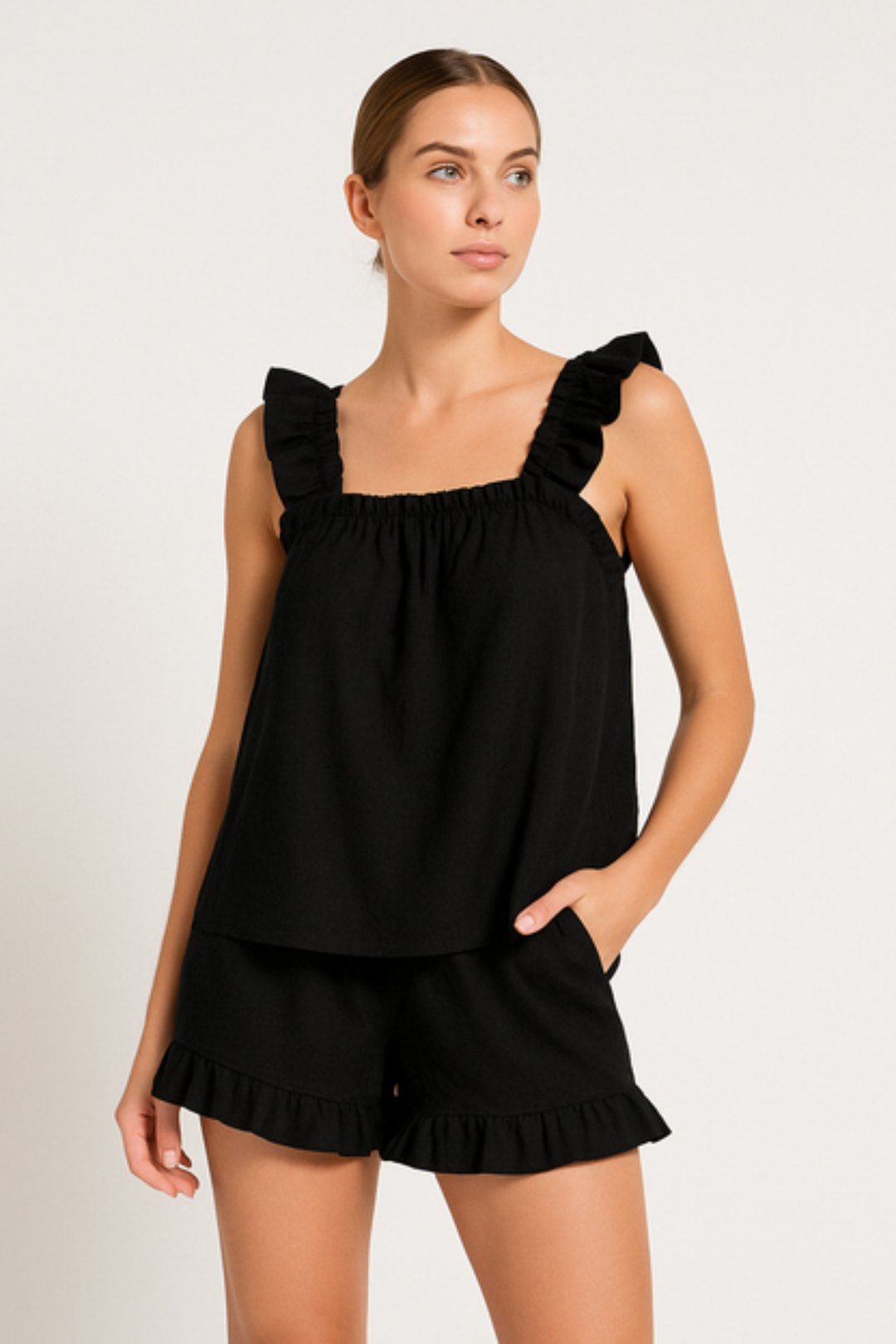 Feminine two-piece ruffle sleepwear set. Lightweight & comfy, ideal women's home wear for summer relaxation.