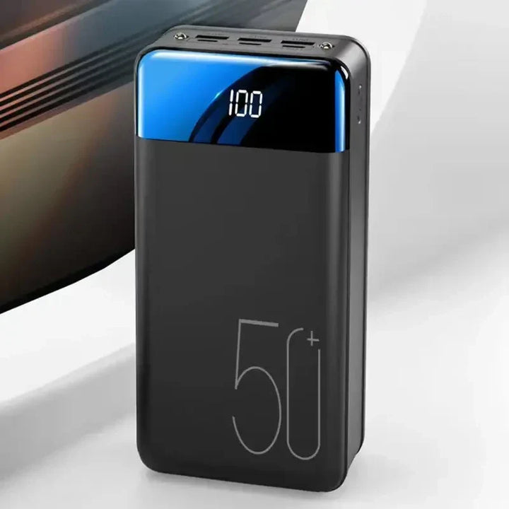 Black 50000mAh ultra-capacity portable power bank for fast charging phones, tablets, and travel accessories.