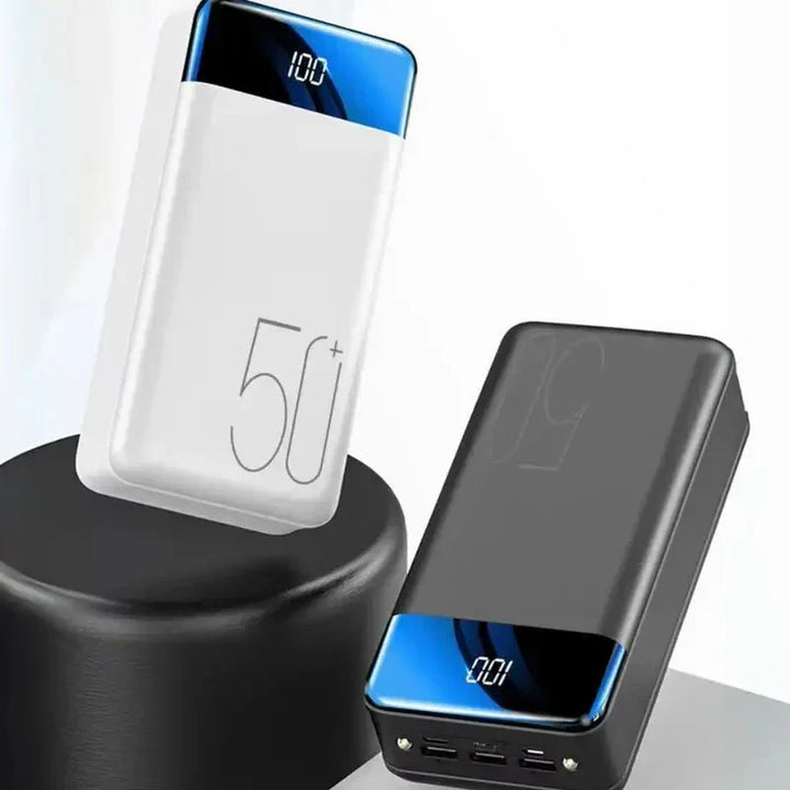 Unisex 50000mAh power bank charging a smartphone, featuring multiple fast-charging USB ports for travel.