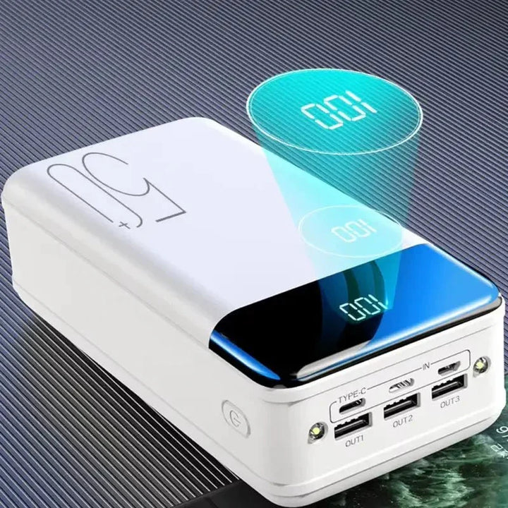 Close-up of a black 50000mAh power bank showing LED display and fast charging ports, a universal mobile charger.