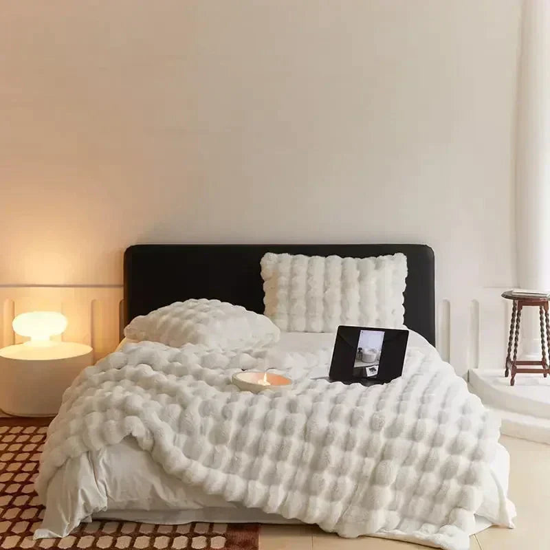Portable faux fur blanket providing warm and snuggly comfort