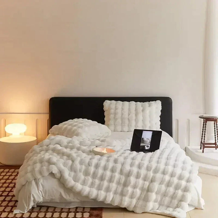 Portable faux fur blanket providing warm and snuggly comfort