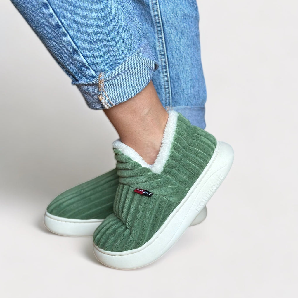 Ultra-warm ergonomic fur slippers providing ultimate comfort for cozy home wear.