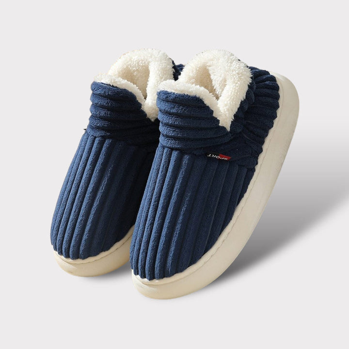 Plush and warm fur slippers designed with an ergonomic fit for indoor comfort.