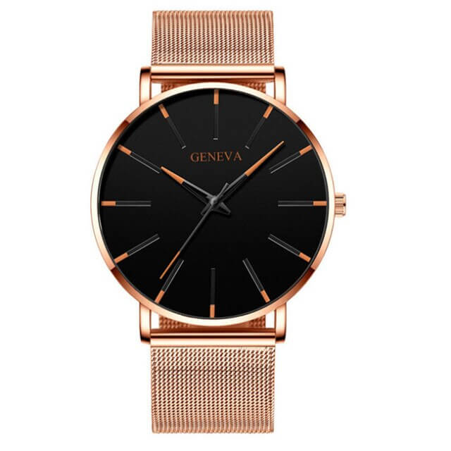 Ultra-slim men's business watch on a man's wrist, complementing a suit, showcasing its professional style.