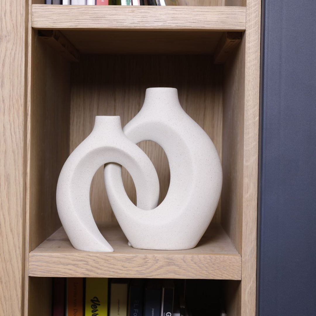 Simple yet elegant ceramic flower vase with a beautiful woven texture for home styling.