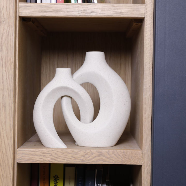 Simple yet elegant ceramic flower vase with a beautiful woven texture for home styling.