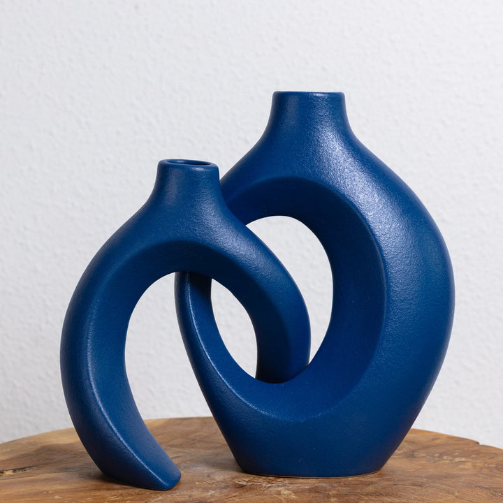 Contemporary ceramic vase, unique woven design, perfect for flowers & home decor.