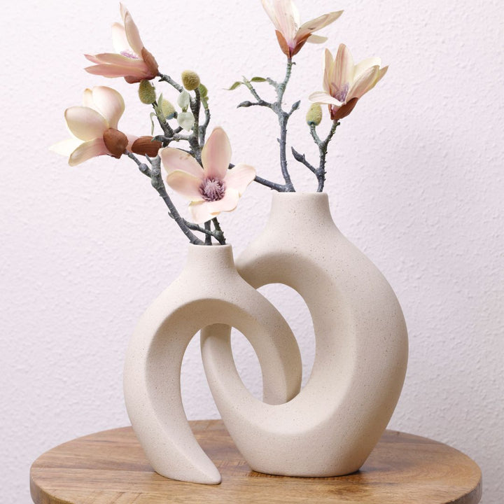 Handcrafted ceramic flower vase featuring a unique woven texture for interior design.