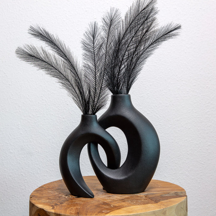 Versatile ceramic flower vase, woven design enhances living room or table decor.
