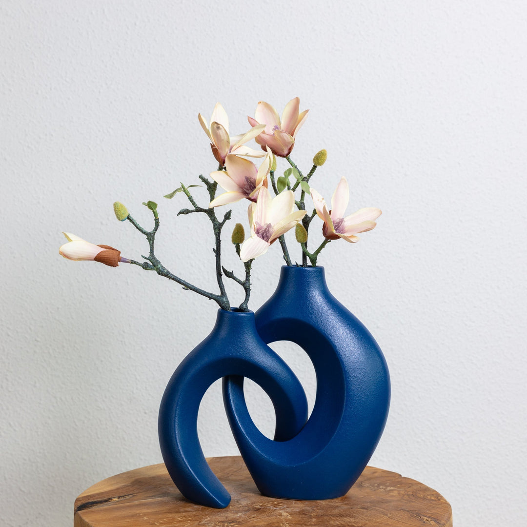 Artisan ceramic vase featuring a distinct woven design, a unique addition to home decor.
