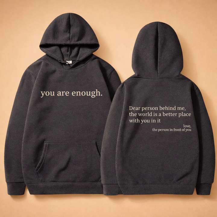 Model in a modern unisex hoodie with drawstring and kangaroo pocket. Perfect for casual comfort and everyday style.