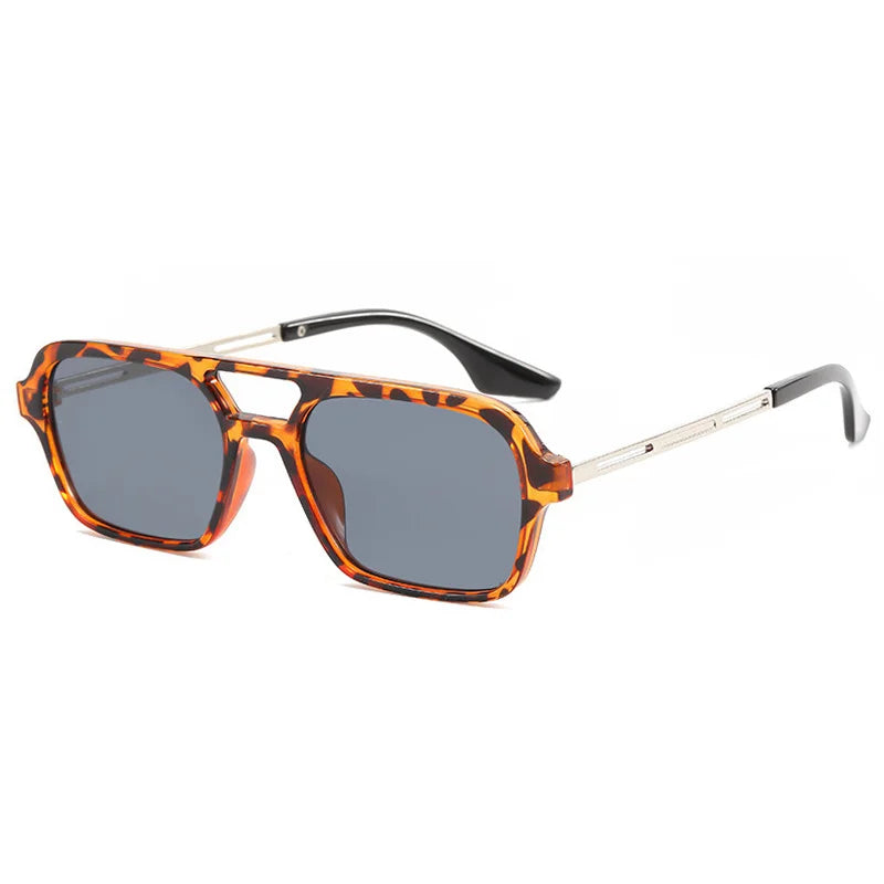 Front view of unisex fashion sunglasses, showcasing their trendy design and UV blocking lenses.