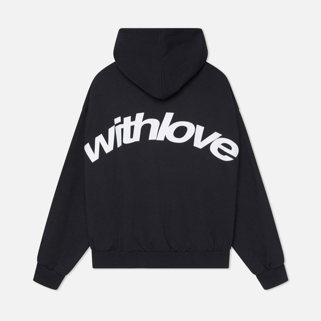 Woman wearing a cozy oversized hoodie, showcasing its comfortable fit & trendy streetwear appeal.