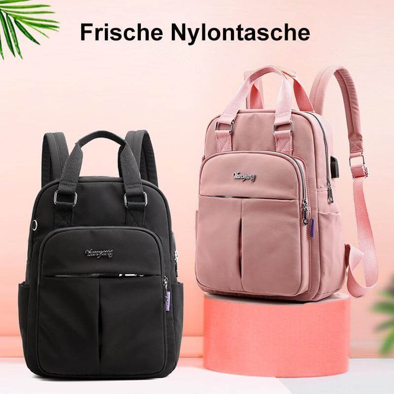 Stylish unisex travel bag, waterproof, with integrated USB port & padded laptop compartment.