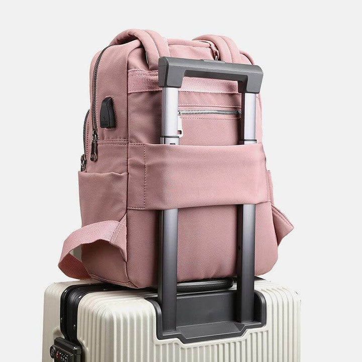 Modern unisex waterproof backpack, perfect for daily carry with USB charging port and multiple compartments.