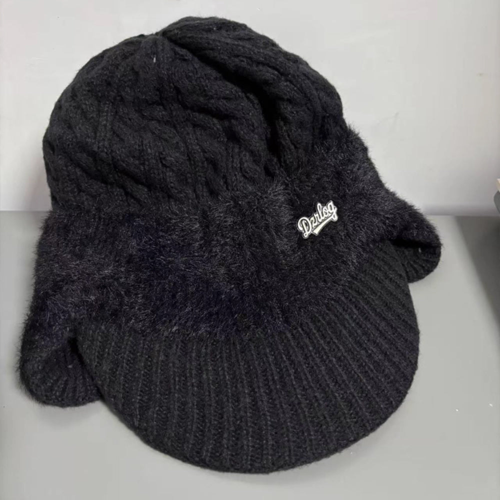 Chic knit beanie with ear flaps, suitable for any outdoor activity.