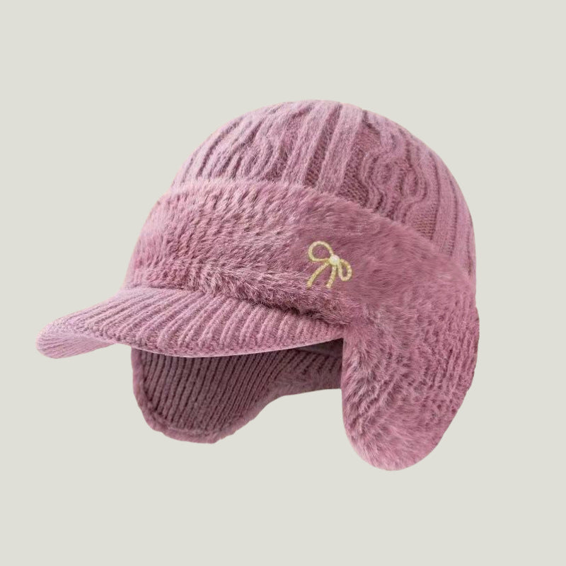A must-have knit trapper hat for navigating chilly winter landscapes.