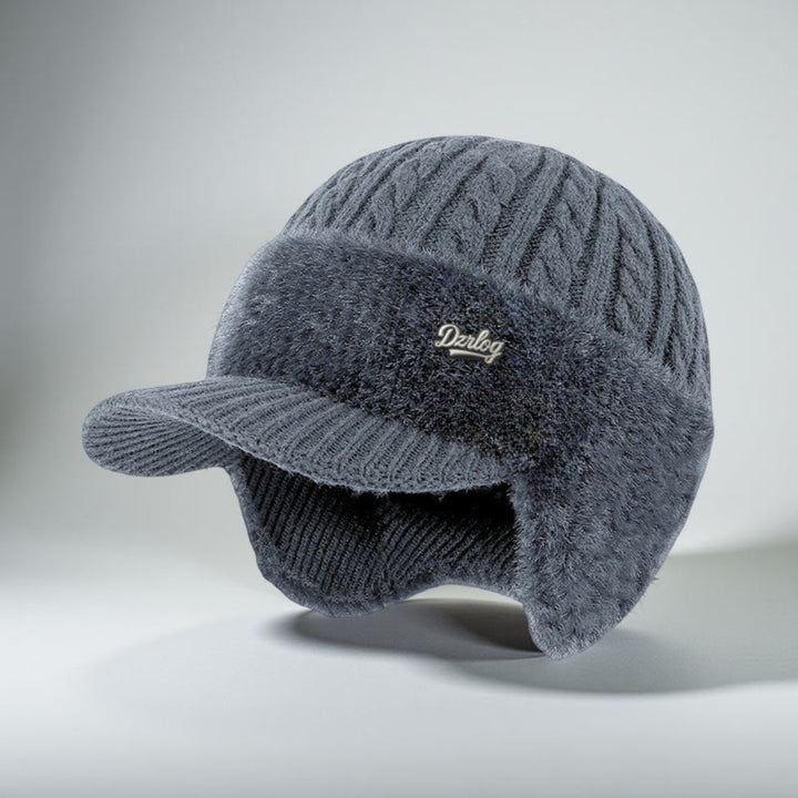 Cozy knit beanie with ear flaps, ideal for staying warm outdoors.