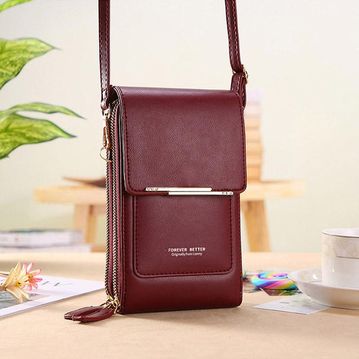 Small women's crossbody phone bag, perfect for travel & keeping your device secure and accessible.