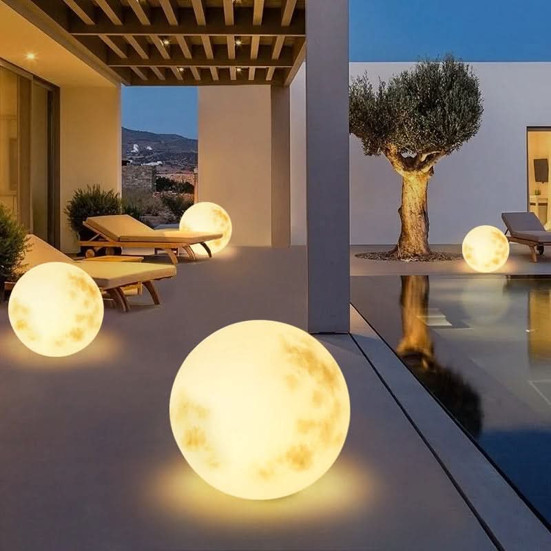 Rechargeable moon lamp illuminating a garden path. Perfect LED outdoor light for patio decor & ambiance.