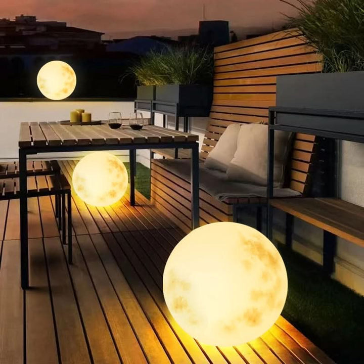 Portable USB rechargeable moon lamp for outdoor use. LED garden light provides cordless ambiance & decor.
