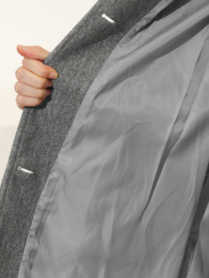 Women's elegant single-breasted trench coat, featuring sleek lapels. Versatile long outerwear for winter & office style.