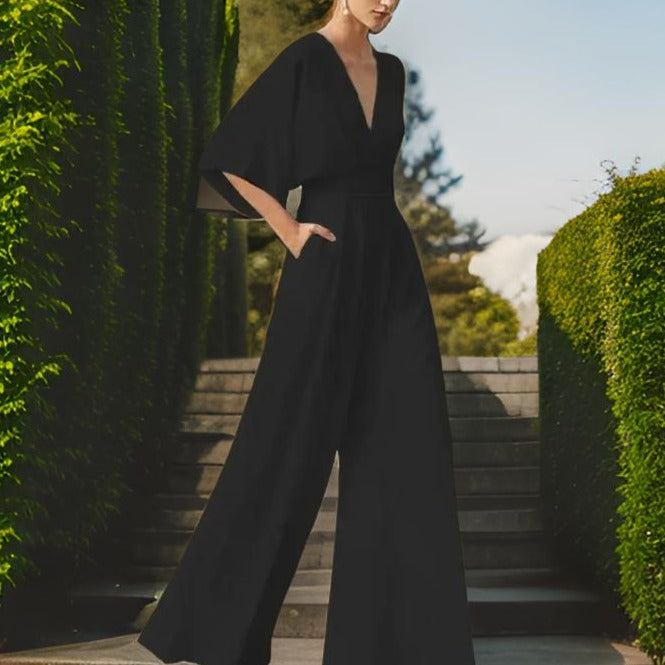 Dressy women's V-neck jumpsuit, three-quarter sleeves, elegant and chic for summer events.