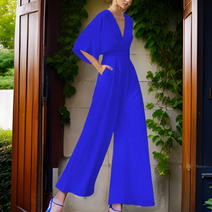 Elegant V-neck women's jumpsuit with three-quarter sleeves, perfect for a dressy summer party outfit.