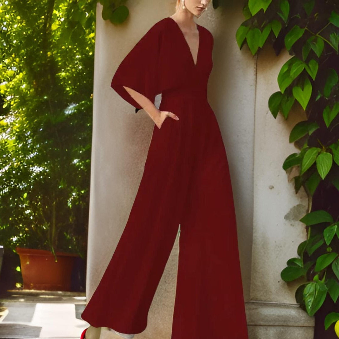 Chic V-neck jumpsuit for women, three-quarter sleeves, versatile for casual wear or elegant parties.