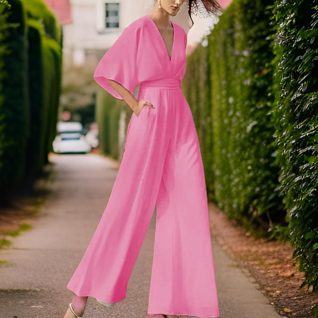 Versatile women's V-neck jumpsuit with three-quarter sleeves, chic for casual and party outfits.