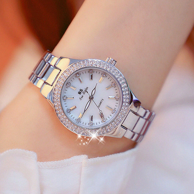 Sophisticated women's gold-tone stainless steel quartz watch, a classic round dial timepiece for an elegant look.