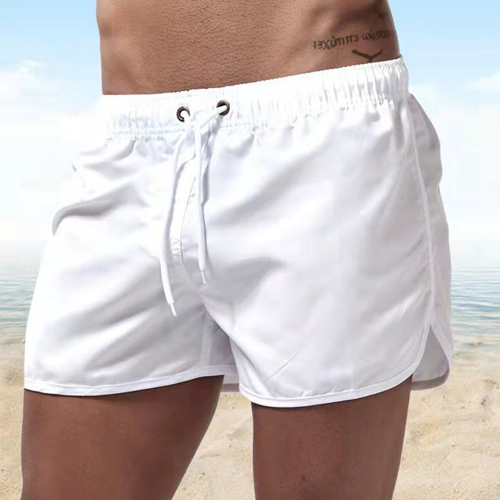 Active men's quick-dry swim shorts. Stylish wave pattern, comfortable for beach & surf with pockets.