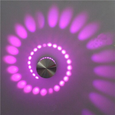 Spiral LED wall light enhancing a modern room with ambient glow. Energy-saving ceiling lamp for home.