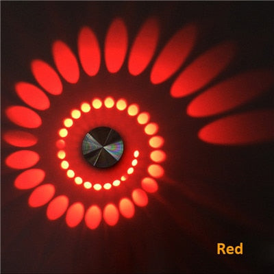 Vibrant multi-color spiral LED wall/ceiling light. Modern ambient mood lighting, energy-saving home decor.