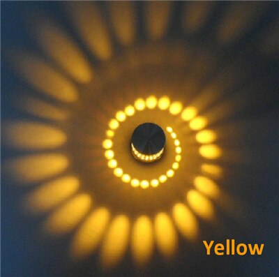 Close-up of the spiral LED light, showcasing modern aluminum design. Wall/ceiling ambient glow fixture.