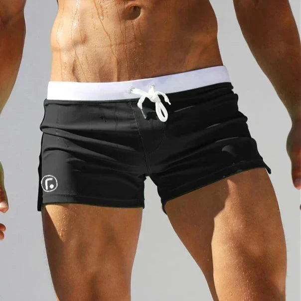 Athletic men's quick-dry swim shorts for active summer vacation, with a secure zip pocket.