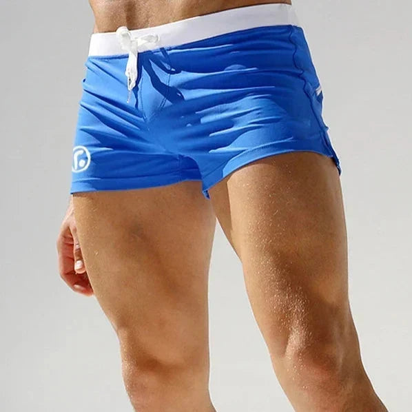 Comfortable men's quick-dry swimwear shorts, perfect for beachwear, with a secure zip pocket.